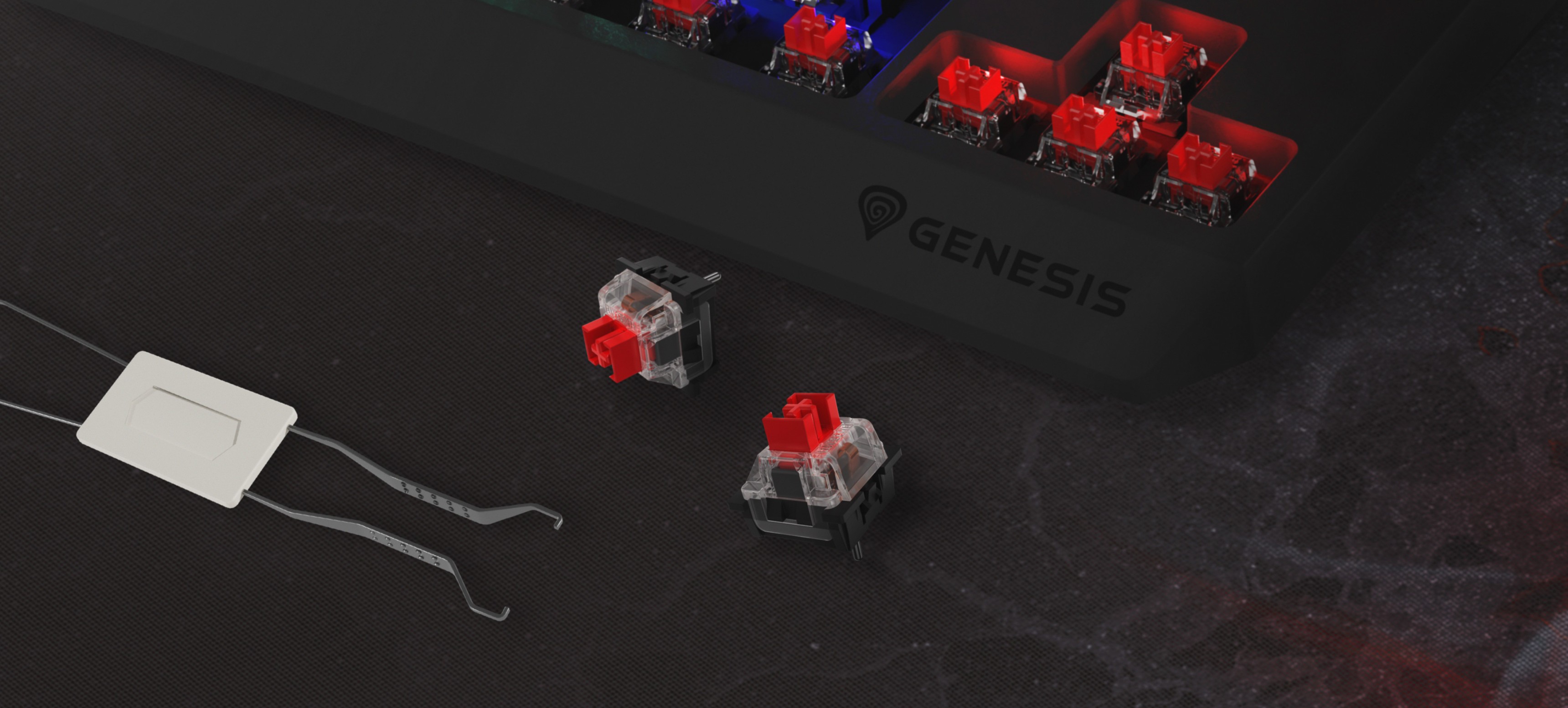 Primer plano del teclado para juegos Genesis Thor 230 TKL Lite con interruptores mecánicos rojos Outemu y una herramienta para extraer interruptores