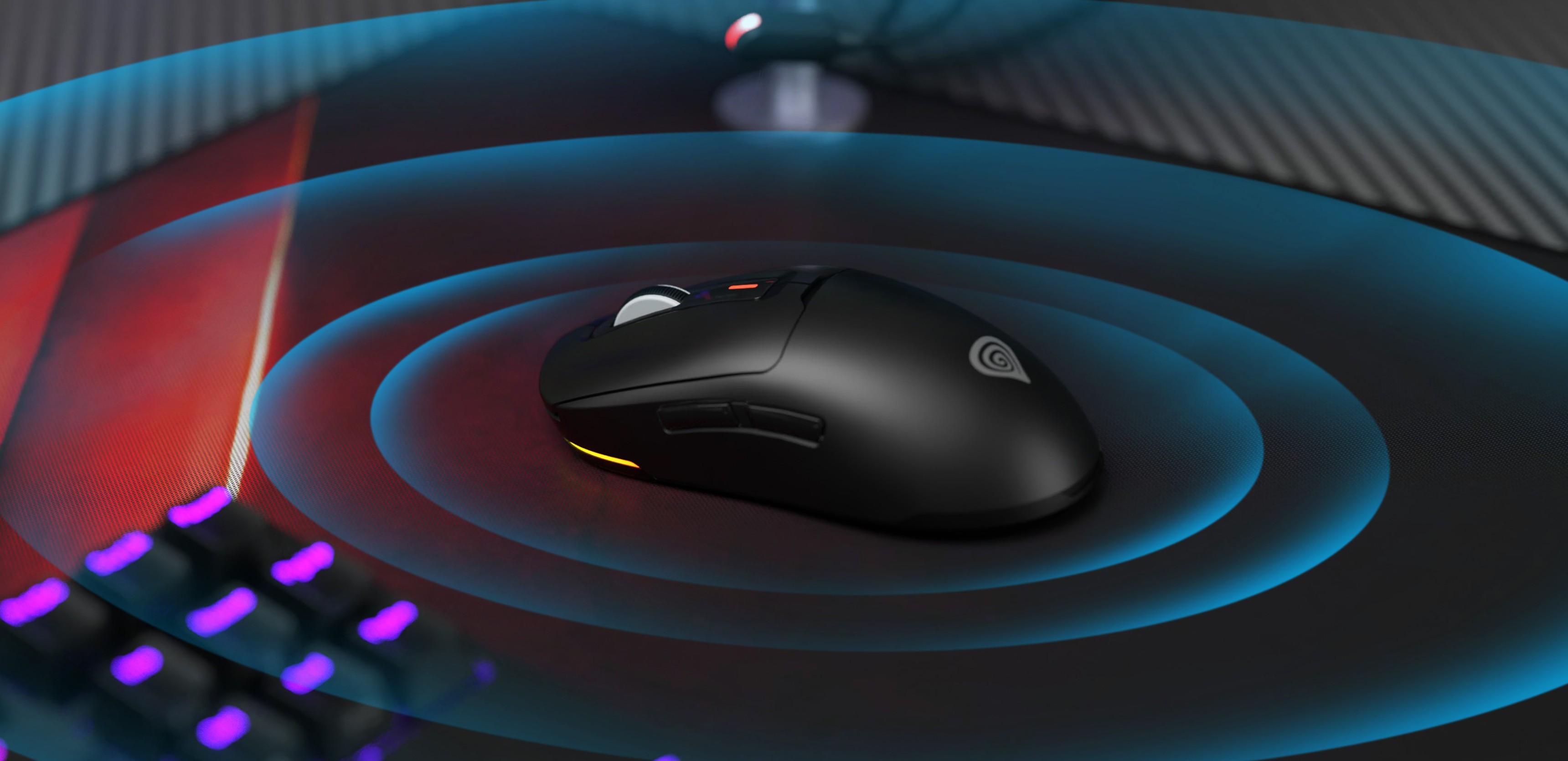 Ratón inalámbrico para juegos Genesis Zircon 660, con un elegante diseño negro y un sensor de 12.000 PPP, colocado sobre una alfombrilla para juegos
