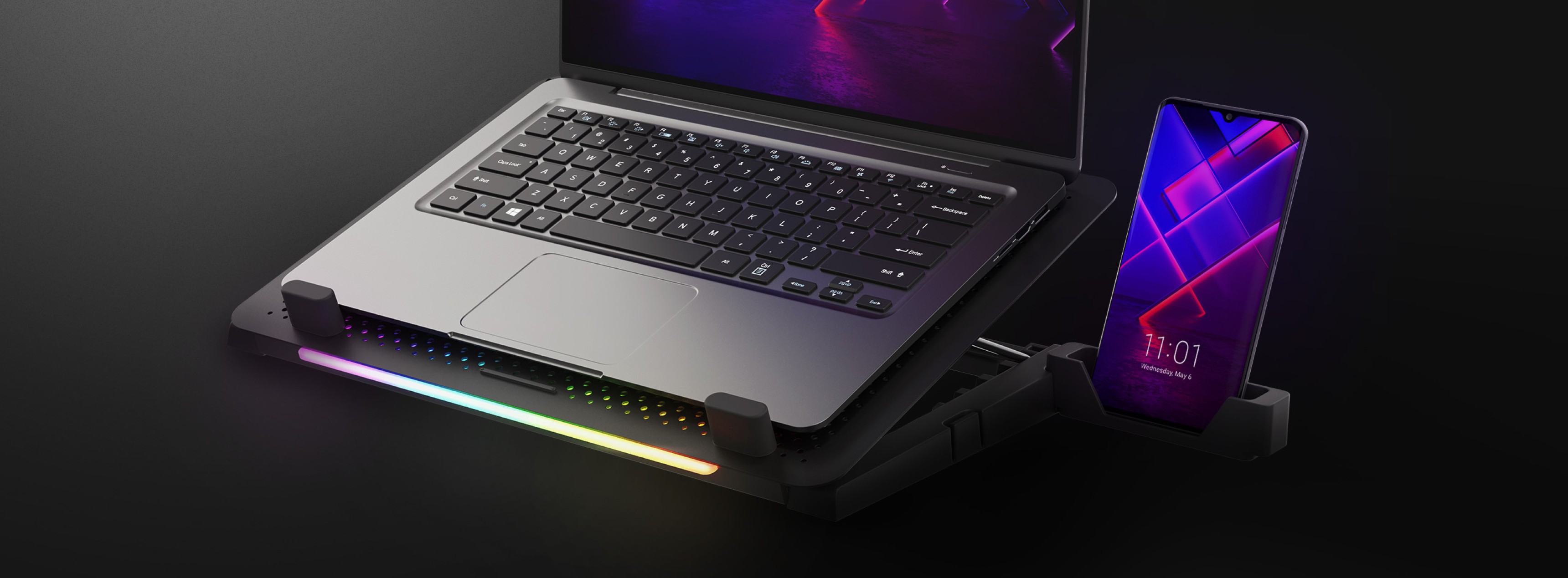 Soporte refrigerante para portátil Genesis Oxid 450 con iluminación RGB, un ventilador y dos puertos USB, con un portátil y un smartphone