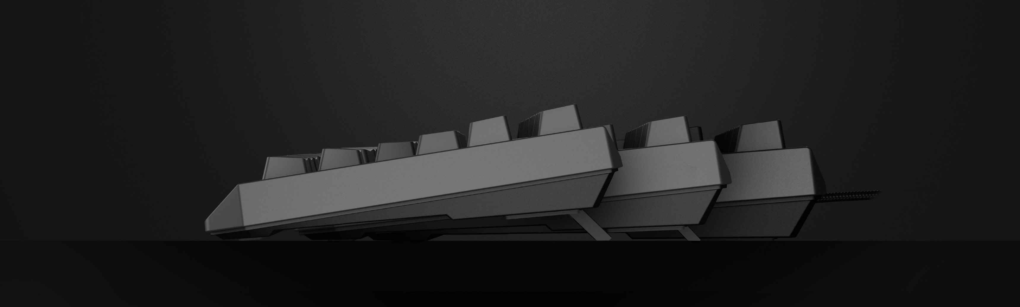 Un teclado mecánico para juegos de color negro mostrado lateralmente, con interruptores Outemu Red y una disposición TKL compacta