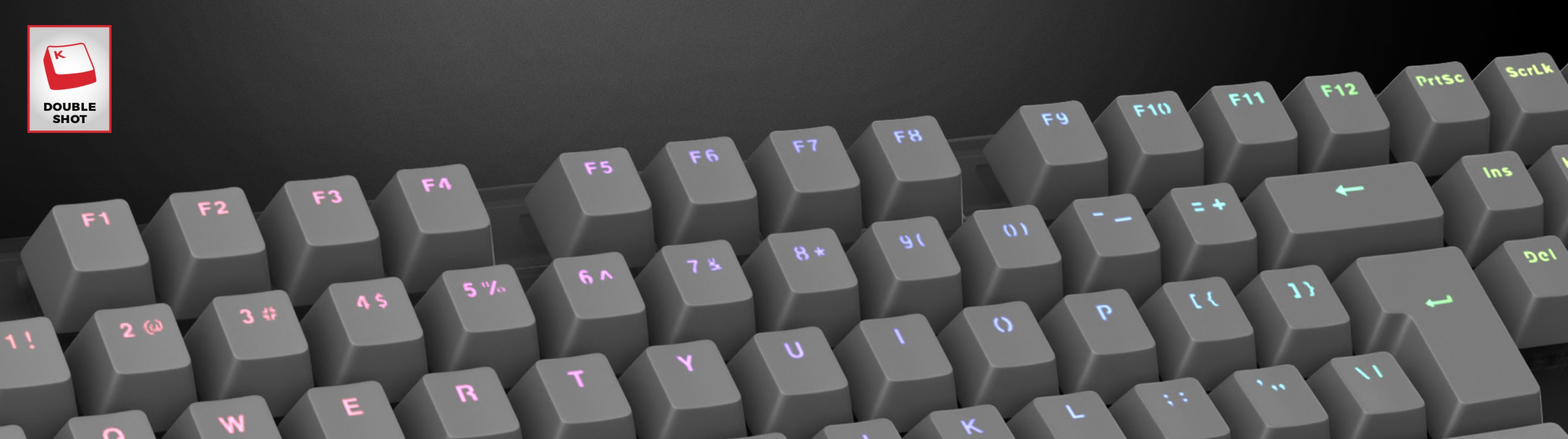 Teclas grises de doble disparo para un teclado, con detalles luminosos para mejorar la visibilidad y el estilo