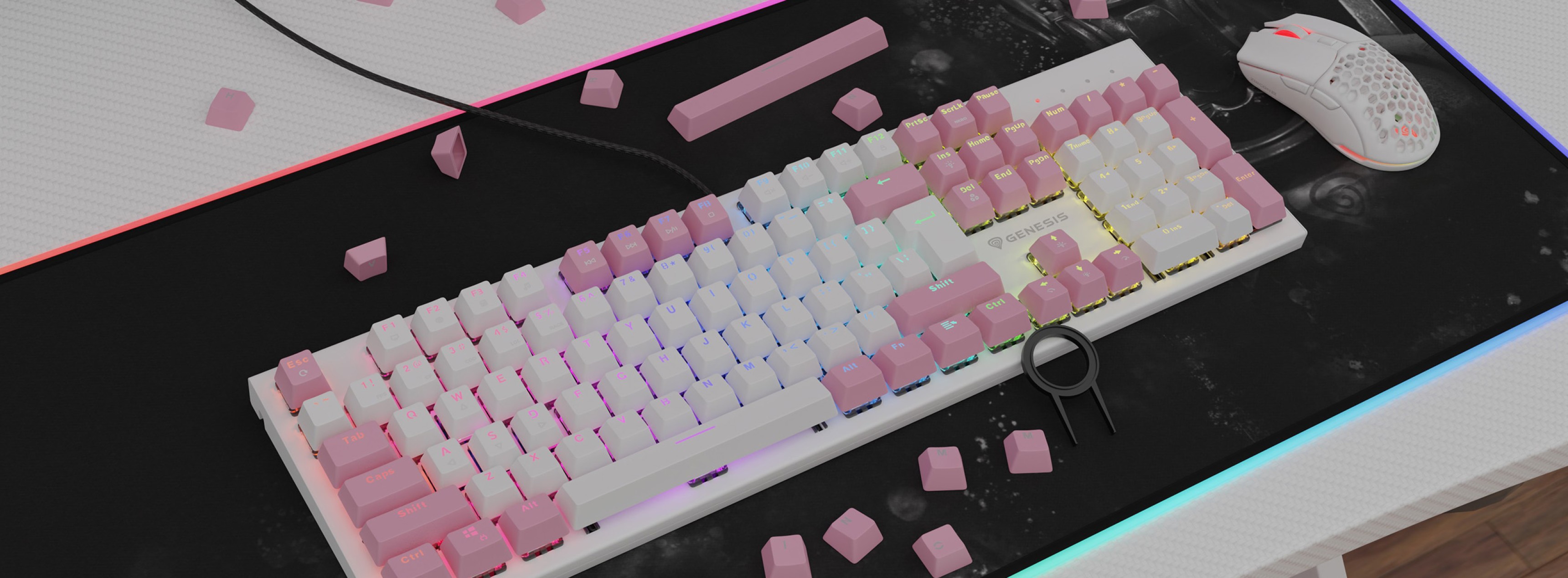 Teclas rosas de doble disparo dispuestas en un teclado mecánico con iluminación RGB, acompañado de un ratón blanco y teclas rosas dispersas